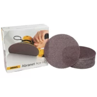 Assorted round abrasive sanding discs next to a Mirka Abranet Ace HD box