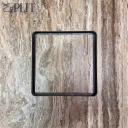 Black square picture frame on a weathered wooden surface, empty in the center.