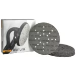 Boxed set of Mirka Iridium sanding discs with perforated surfaces and dust holes beside the box.