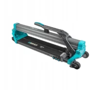 Turquoise and gray manual tile cutter with a long rail system and a top handle for sliding and scoring tiles against the bed.