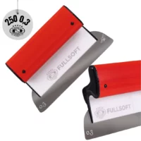 OLEJNIK Szpachla powierzchniowa nóż pióro do gładzi FULLSOFT 250MM OSTRZE NIERDZEWNE WYMIENNE 0,3MM OKRĄGŁE ROGI (1239250G3FS) Knife sharpener tool with orange body and gray abrasive surface, branded FULLSOFT, shown at an angle.",