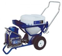 Blue and white tow-behind fertilizer spreader with a large hopper and two wheels for lawn use.