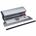 Silver and black desktop stapler resting on a white surface, ready to staple papers